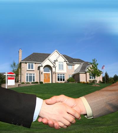 Two men shaking hands closing a real estate transaction