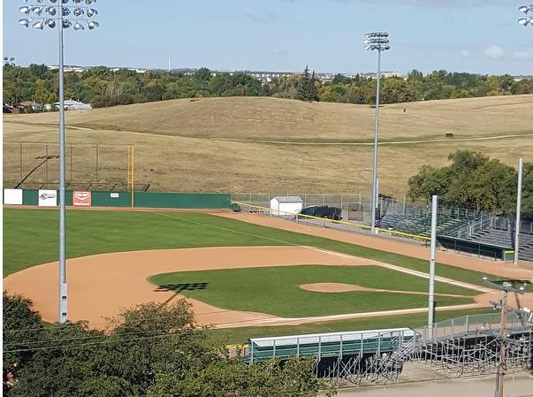 Ariel view of Regina Redsox baseball diamond with clay infield and green grass infield and outfield rolling hills and blue sky i